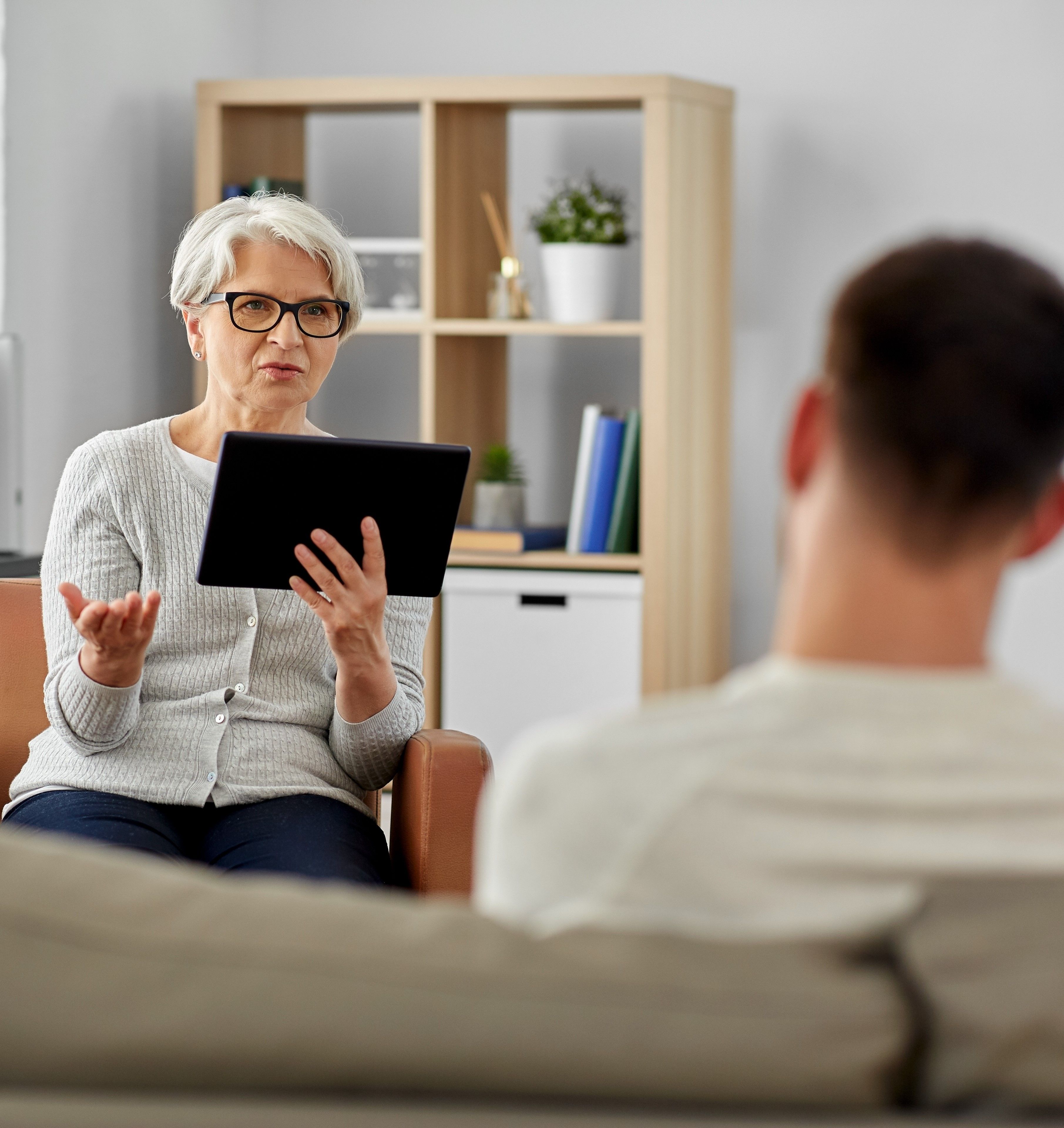 Psychologist using digital mental health assessments